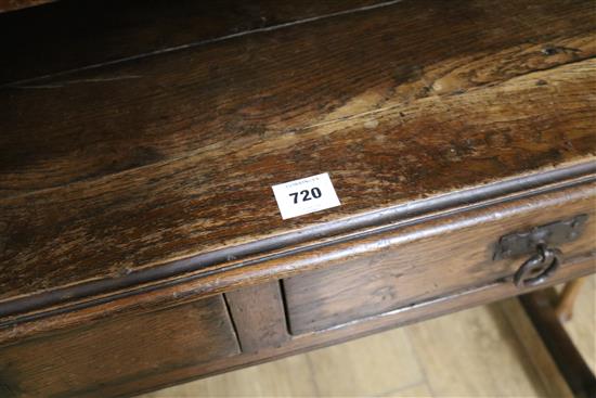 An oak side table with two drawers, W.107cm